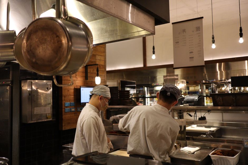 Professional chef preparing authentic Italian cuisine in a commercial kitchen